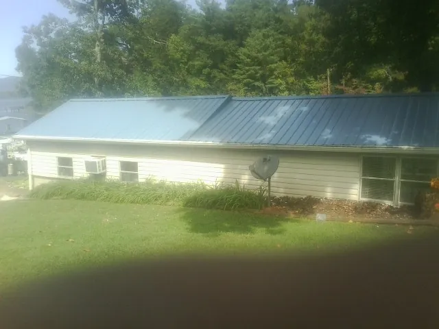 Blue metal roof running the length of a single story home in Westwood